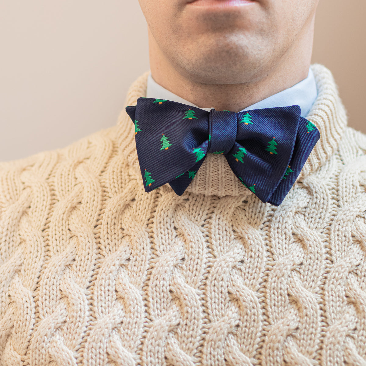 Navy blue Christmas tree bow tie with white knit sweater